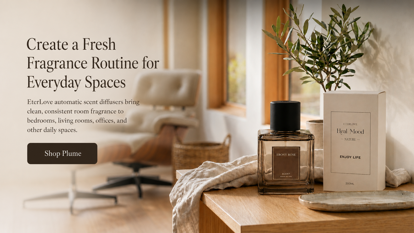 EterLove Plume automatic scent diffuser with Ebony Rose fragrance bottle and packaging on a warm wooden table in a cozy home interior.